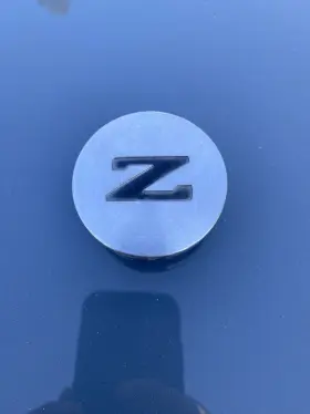 4034303p00 Nissan 580.da1z85 1984-1986 300zx Z31 2 Center Cap