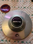 Ultra #8355 Older Shaded Polished 7-1/4" Wheel Center Cap Rise Hex Amg Emblem. Used. Price: $79.99.