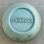 (1) Mazda B2300 B2500 Factory Oem Center Hub Cap F47A-1A096-DA F47A1A096DA Used. Price: $15.98.