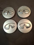 Set Genuine Silver 09 14 Infiniti QX80 QX56 Wheel Center Caps 40342-1LB4A Used. Price: $30.00.