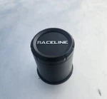 3.19 Black Push Thru Center Cap Raceline New. Price: $10.95.