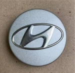Hyundai Oem Silver Center Cap. #529602L320. 2-1/4" Diameter. Used. Price: $10.95.