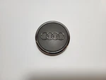 Silver And Chrome Audi Wheel Center Cap. 8TO-601-170A (2NOH); 4B0-601-170A (1NOH Used. Price: $12.00.
