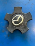 Mazda Center Cap (P10526) G22B V3 815 Used. Price: $34.19.