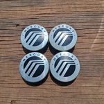 Mercury Mariner Center Cap Set Of 4, 2008-2011 Part # 6M64 1A096 Ab B1 Used. Price: $34.95.