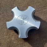 Toyota Solara Center Cap 1998-2001, Silver And Machined Aluminum, Part# 8888 02 Used. Price: $19.95.