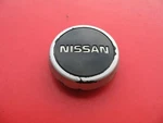 85 Nissan Sentra (1) Wheel Rim Center Cover Plug Used #2286. Price: $12.00.