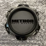 Method Race Wheels CP-T077L122-B Center Cap, Screw-on, Black New. Price: $50.00.