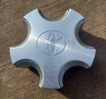 Toyota Solara Center Cap 1998-2001, Silver And Machined Aluminum, Part# 8888 03 Used. Price: $19.95.