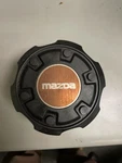 87 88 89 90 92 93 Mazda B-2600 Oem Center Hub Cap S23237191 64691 Used. Price: $40.00.