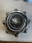 2000 Ford Excursion Center Cap #F81A-1A096-BB/ #F81A-1A096-CA Used. Price: $20.00.