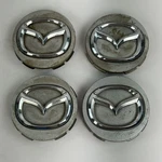 Mazda Oem Wheel Center Caps Set Of Genuine DB2874 Logo Hubcap Covers Used. Price: $22.99.