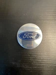 Oem Ford Center Cap 6M21-1003-AA (54MM) Used. Price: $9.00.