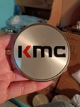 T154K77 Kmc Grey Wheel Center Cap BC-968 1) Single Pop Hub Cover Emblem Used. Price: $25.00.