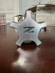 Nissan 280ZX Wheel Center Cap (1) P/n 40343 19P00 Oem Used. Price: $25.00.