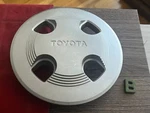 #b 1) 1984-87 Toyota Corolla Hubcap Wheel Center Lug 716643-0010 Used. Price: $24.95.