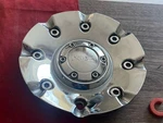 #c 1) Incubus Center Chrome Wheels EMR0716-TRUCK-CAP LG0608-83 Used. Price: $19.95.