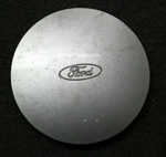 Oem Ford Center Hub Cap Silver F0KM1A096BA F0TJ1A096AA Broken Tab Used. Price: $16.00.