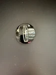 Single Oem Black Center Cap For 18-20 Lincoln Navigator JL74-1A096-AA 560-10177 Used. Price: $25.00.