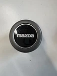 (1) Mazda F27A-1A097-BA Black Wheel Center Cap 92 B2000 B2200 Truck Used. Price: $25.00.