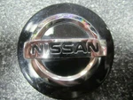 Nissan Black & Chrome Oem Center Cap 2-1/8" 54MM 40342-2M70B ONE/1* Used. Price: $10.00.