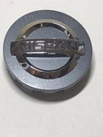 New Genuine 2014-2018 Nissan Murano Altima Rogue Center Cap Ornament 40342 4RB5A. Price: $34.00.