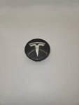 One (1) Oem Tesla Center Cap Model Number 2624 6005879-00-A Used. Price: $30.00.