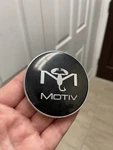 Motiv Wheel Center Cap Snap-in, Black (pn: 622K67 / LG1010-14) Oem Used. Price: $9.00.