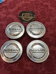 Set Of Nissan Altima Sentra Versa Maxima Rogue Wheel Center Caps 40343-AU51A Used. Price: $26.12.