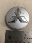 2002-06 Mitsubishi Diamante Hubcap Dust Cover Oe 1BY37TRMAA 52014443AA Used. Price: $15.00.