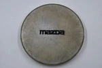 Mazda Silver /w Black Logo Wheel Center Cap Hub H268 37 190 7.125" 1989-91 Used. Price: $22.00.