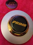 X1 Prime 6-1/4" Wheel Center Cap #93 Good Gold Hex Top On Painted Silver Flange Used. Price: $84.90.
