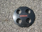One Genuine 1987 1988 Nissan Sentra Alloy Wheel Center Hubcap Used. Price: $17.00.