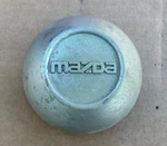 (1) Mazda B2300 B2500 Factory Oem Center Hub Cap F47A-1A096-DA F47A1A096DA Used. Price: $15.98.