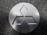 Mitsubishi Silver Metallic Oem Center Cap 2.0" 51MM MR455633 - ONE/1 Used. Price: $10.00.
