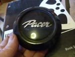 Pacer Center Cap (P8817) 89-9756BKH Used. Price: $34.19.