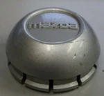 Original Genuine Mazda Center Hub Cap Silver F47A-1A096-DA F47A1A096DA Used. Price: $15.99.