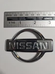 Nissan Wheel Cap Emblem Rim Badge Pn 40342-0E0600 Used. Price: $7.95.